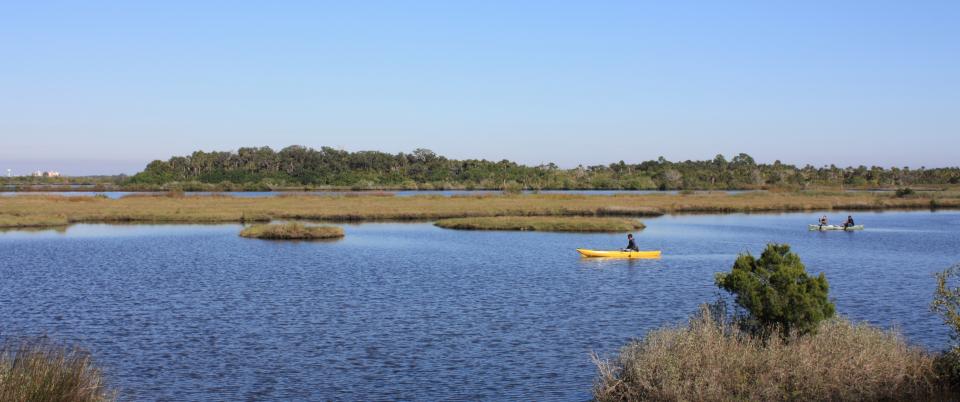 Kayaks play in the waters of the park