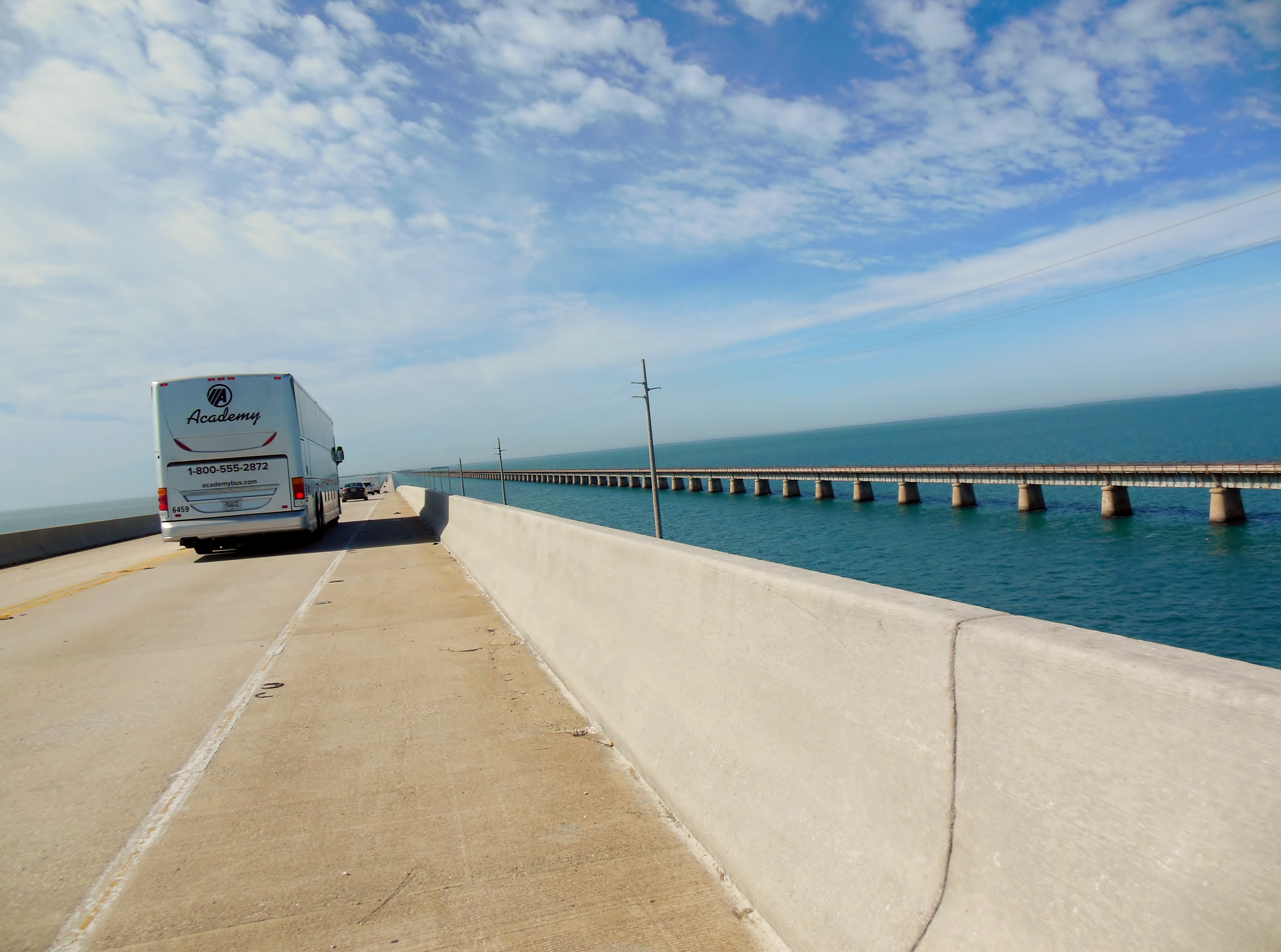 Crossing the Seven Mile Bridge. Some high-speed traffic, and concrete barriers block the view a bit, but still a spectacular ride across the water.